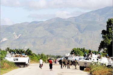 REUTERS /Jordanian U.N. peacekeepers take control of a road at the entrance of the volatile neighbourhood of Citi-soleil in Port-au-Prince, Haiti November 25, 2005. Haiti, struggling to hold an