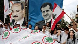 f_Young supporters of the Christian Lebanese Forces militia mourn the death of Lebanon's prominent anti-Syrian MP and