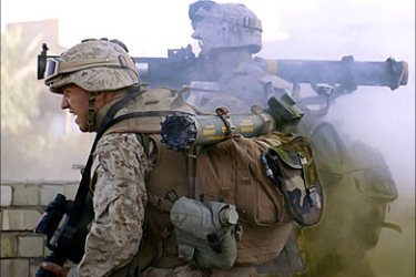 f_A picture released by the US Marines 01 December 2005 showing a marine firing his