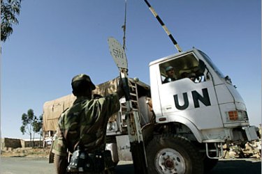 . AFP (FILES) This file picture taken 19 November 2005 shows an Ethiopian soldier opening the gate to a MINUEE (UN Mission to Ethiopia and Eritrea) truck that drives into the