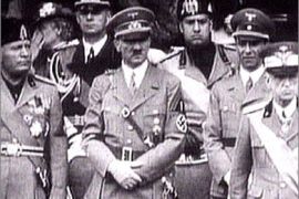 r_King Victor Emanuel III, (R) Adolf Hitler (C) and Benito Mussolini (L) watch fascist troops march past