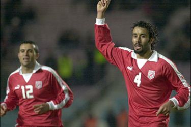 afp - Tunisian striker Sofienne Milliti(4) celebrates after scoring against Ghanna during their friendly football match at Rades Stadium in Tunis 15 January 2006