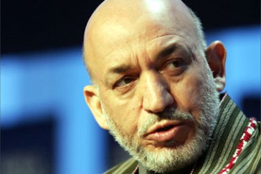 Afghan President Hamid Karzai talks during the session "US Freedom and Democracy Agenda" at the World Economic Forum in Davos 28 January 2006.