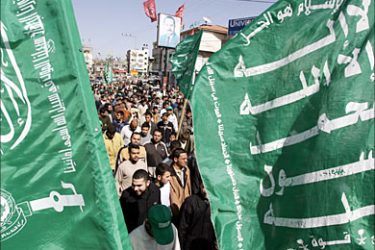 f_Green party flags flutter as Hamas supporters protest during a rally organized by the Islamist group