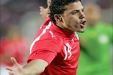 f_Egyptian forward Amr Zaki celebrates his goal, the second during the semi-final football game between Egypt and the Teranga Lions of Senegal in the group A for the African Nations Cup (CAN) held in Cairo 07 February, 2006. Egypt won the match 2-1 qualifying for the finals.AFP PHOTO/KARIM JAAFAR