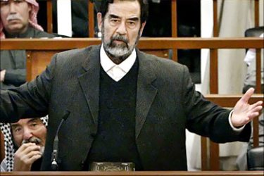 f_Former Iraqi President Saddam Hussein speaks at his trial in Baghdad March 1, 2006. Deposed Iraqi