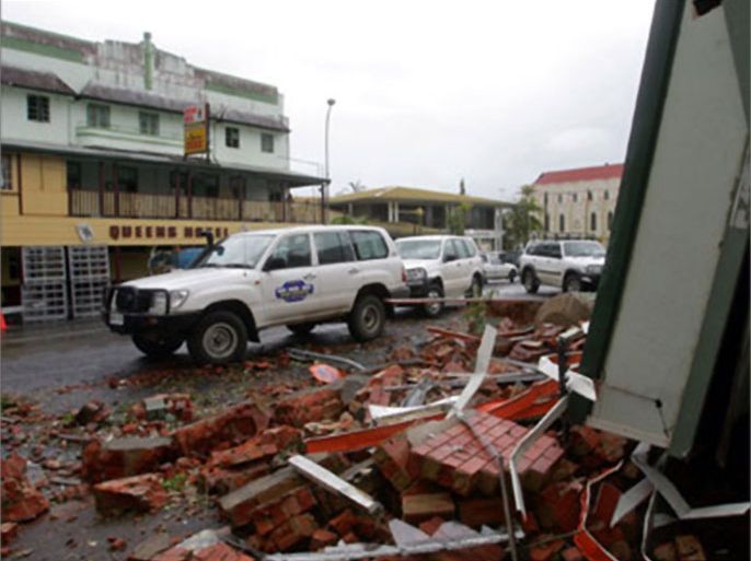 A building destroyed by Cyclone Larry lies as rubble on the main street of Innisfail, about 100 km (62 miles) south of Cairns in northern Queensland March 22, 2006.