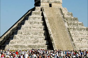 f_Thousands of tourists surround the Kukulkan Pyramid at the Chichen Itza archeologic site during
