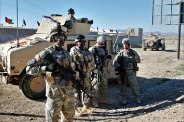 US soldiers stand guard in the southern town of Qalat, the capital of Zabul province, 28 March 2006. Two foreign soldiers, one of them American, serving with the US-led coalition in Afghanistan were killed in an attack in which about a dozen "enemy" were killed, the coalition said