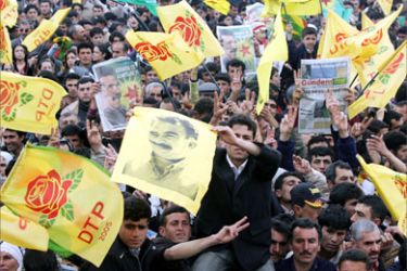 Kurds hold a poster of imprisoned Kurdish rebel leader Abdullah Ocalan during celebrations of the Kurdish New Year festival, Newroz, in Diyarbakir, 21 March 2006.