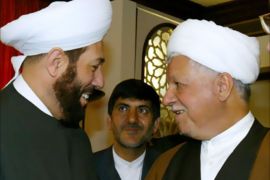 Chairman of Iran's Expediency Council Akbar Hashemi Rafsanjani (R) greets Syrian Mufti Ahmad Hassun (L) in Damascus, 13 April 2006.