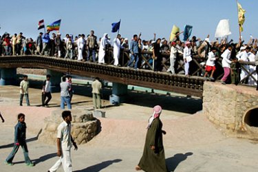 Egyptian bedouins from the Red Sea resort town of Dahab march during a protest of locals and tourists 25 April 2006 against the attacks that hit Dahab