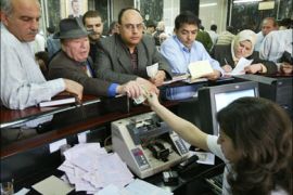 afp - Syrians donate money for the Palestinian people at a bank in Damascus 30 April 2006. Syria on April 16 announced it was launching a fundraising campaign