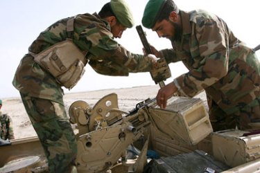 Afghan National Army soldiers prepare a vehicle-mounted anti-aircraft gun for firing during an Afghan-led operation to arrest suspected Taliban operating in the Panjwayi district