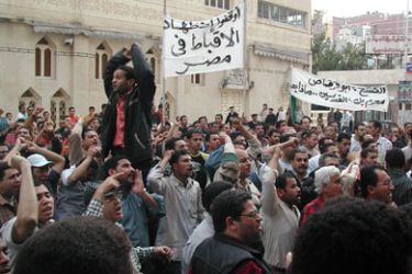 Egyptian Coptic Christians demonstrate holding a banner reading "Stop oppressing the copts of Egypt" in Alexandria 14 April 2006, after one Egyptian Christian was killed