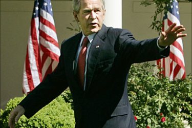 r_U.S. President George W. Bush waves to participants after making remarks at an event honoring the Preserve