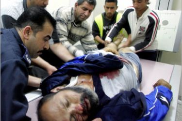 Palestinians carry the body of Zakhariah Darghmeh, 38, at the morgue in the city hospital of the West Bank city of Nablus