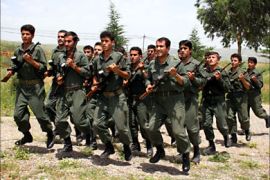 f_Iranian Kurdish Peshmarga militiamen march during routine military exercises in Koya, 100 km north of Arbil, located 350 kms north of Baghdad, 10 May 2006. A political union