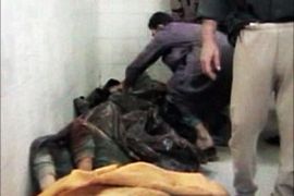 r_An image taken from footage shot on November 19, 2005 shows bodies in a morgue after an incident in Haditha, about 140 miles (220 km) northwest of Baghdad. U.S. Marines could face criminal charges, possibly including murder, for their involvement in the deaths of up to two dozen Iraqi civilians in Haditha last November, a defense officials said on May 26, 2006.