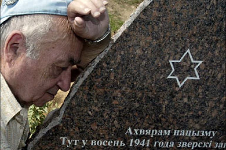 f_A man mourns in front of a monument of the victims of the Holocaust, during the opening ceremony in Belarus' town of Smolevichi, some 45 kms from Minsk, 26 June 2006