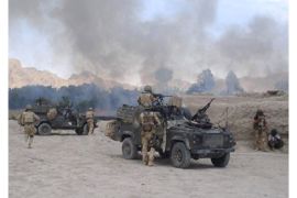 A handout picture from the British Ministry of Defence taken 04 June 2006, in the vicinity of Nawzad in southern Afghanistan shows British soldiers from 3 Para engaged in fighting with Afghan militants.