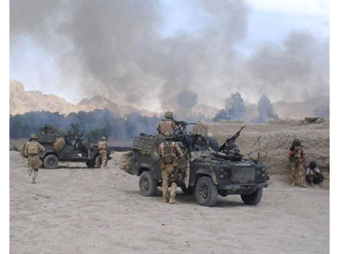 A handout picture from the British Ministry of Defence taken 04 June 2006, in the vicinity of Nawzad in southern Afghanistan shows British soldiers from 3 Para engaged in fighting with Afghan militants.