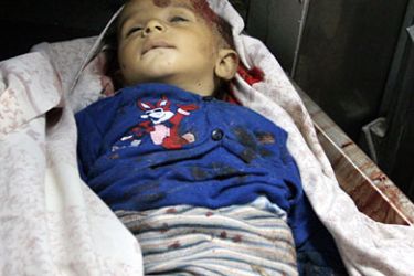 The body of one-year-old Palestinian boy Haitham Gali, killed by an Israeli shell that hit a beach in the northern Gaza Strip 09 June 2006, rests at the morge of a hospital in Gaza City,