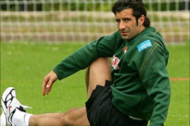 f_Portugal's football player Luis Figo stretches at the end of a team training session at The Klosterpforte Hotel in Marienfeld, 26 June 2006, during the FIFA World Cup. Portugal captain Luis Figo is free to face England in the World Cup quarter-finals after FIFA said he was highly unlikely to face any action for headbutting Dutch player Mark van Bommel. AFP PHOTO NICOLAS ASFOURI
