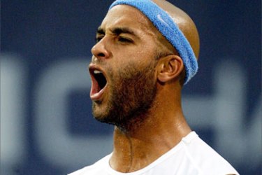 James Blake of the US celebrates match point against Nicolas Mahut of France during the RCA Championships 21 July 2006 at the Indianapolis Tennis Center in Indianapolis, Indiana.