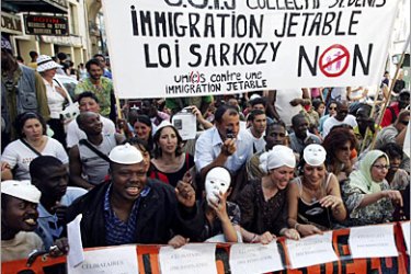 AFP - Thousands of people demonstrate 01 July 2006 in Paris against a new immigration law, proposed by right-wing Interior Minister and presidential hopeful Nicolas Sarkozy.