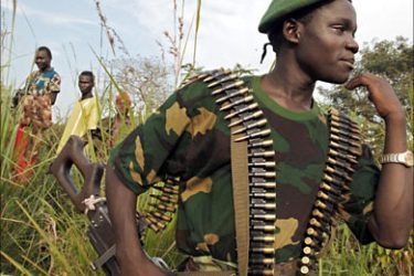 f_Young fighters of the FRPI militia (Patriotic Force of Resistance for Ituri) wait on the side of the road, 26 July 2006