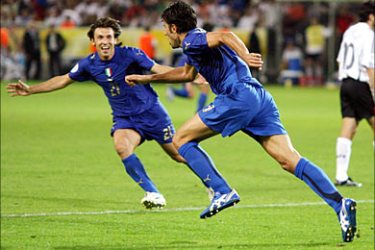 r_Italy's Fabio Grosso (C) celebrates his goal against Germany with team mate Andrea Pirlo as Germany's Oliver Neuville (R) walks away during their World Cup 2006 semi-final soccer match in Dortmund July 4, 2006. FIFA RESTRICTION - NO MOBILE USE REUTERS/Kai Pfaffenbach (GERMANY)