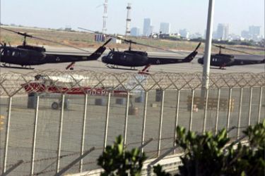 Lebanese army choppers sit on the tarmac after an Israeli air raid shut down Beirut international airport, resulting in cancelled flights and stranded passengers, 13 July 2006. The Israeli army said today it fired missiles at Beirut's international airport to prevent the transfer of weapons and supplies to the Hezbollah militia, which abducted two soldiers and killed eight in attacks yesterday.