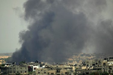 Smoke rises in the Palestinian town of Beit Hanun in the northern Gaza Strip following Israeli air strike 11 July 2006. A Palestinian security officer was killed and six people