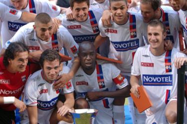 Lyon's players pose with their trophy, 30 July 2006 at Gerland Stadium in Lyon, central eastern France, after winning the Champions Trophy match, opposing Lyon, winner
