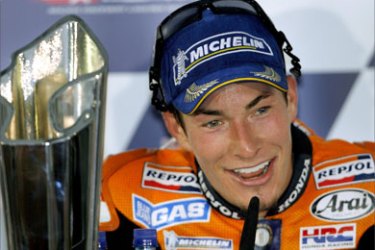 Honda MotoGP rider and winner of the 2006 U.S. Grand Prix Nicky Hayden of the U.S. answers questions from the media following the race at the Laguna Seca racetrack near Monterey, California July 23, 2006.