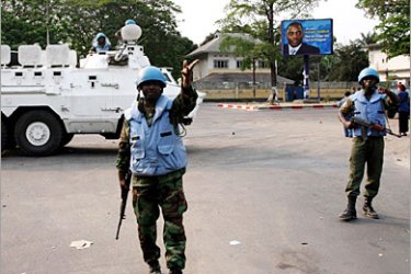 REUTERS/ Ghanaian U.N. peacekeepers man a checkpoint in the Democratic Republic of Congo's capital Kinshasa, August 22, 2006. The European Union rushed more peacekeepers to