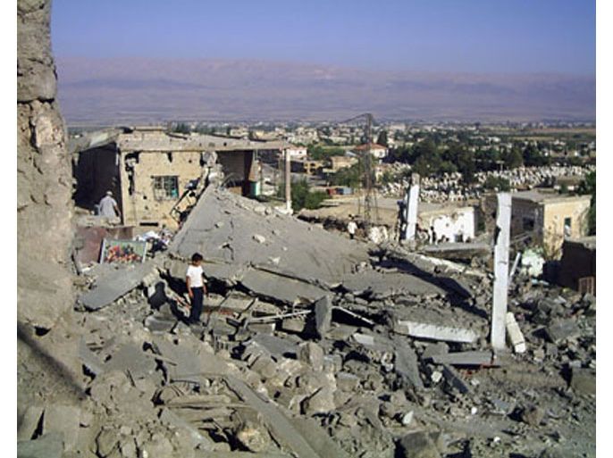 General view of destroyed houses after an overnight Israeli air raid on Brital, 10 km south of Baalbeck, August 8, 2006. Nine people were killed in the attack.REUTERS/