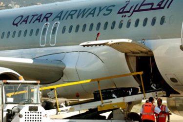 Luggages are downloaded from Qatari Airways plane that landed Beirut airport despite Israel blockade,