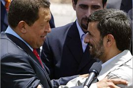 AFP/Venezuelan President Hugo Chavez (L) hugs his Iranian counterpart Mahmoud Ahmadinejad, at Simon Bolivar airport in La Guaira, 30 km from Caracas, 17 September 2006. Ahmadinejad arrived in Venezuela for two days of talks on energy and other matters.