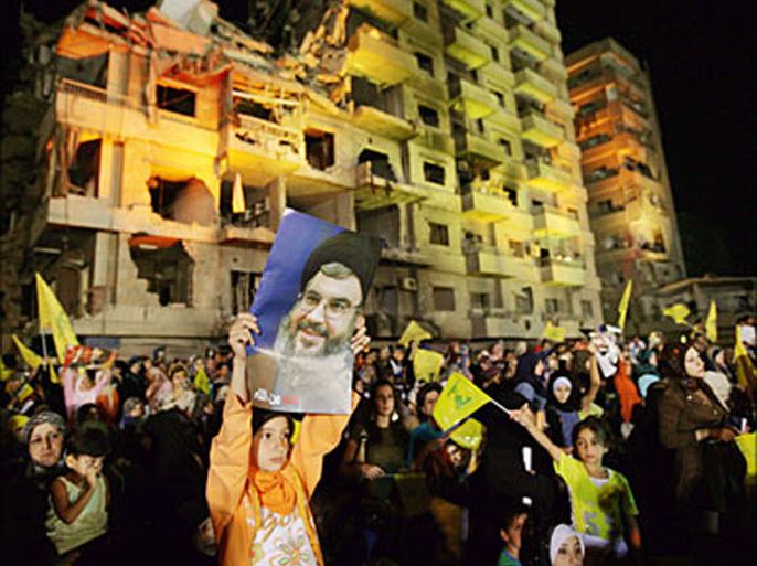 r_A girl holds a poster of Hizbollah leader Sayyed Hassan Nasrallah during a rally in a southern Beirut suburb September 11, 2006