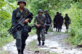 AFP / Philippine Marines patrol a village in Patikul Jolo island, 14 September 2006, where government security forces are fighting the al-Qaeda linked Abu Sayyaf. Philippine military,