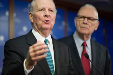 f_Former US secretary of state James Baker (L) of the Iraq Study Group speaks as former member of Congress Lee Hamilton, also a member of the Iraq Study Group, looks