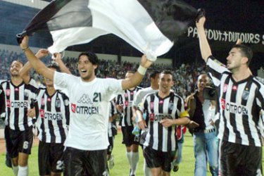 Tunisian Club Sportif Sfax' (CSS) players celebrate after qualifying in their African Champions League football match against South Africa Orlando Pirates,