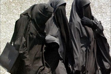 f_ A file picture dated 23 July 1999 shows fundamentalist Muslim women wearing the niqab, or full face veil, as they walk to Friday prayers at a mosque in Cairo. A top Egyptian court had banned schoolgirls from