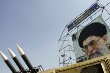 AFP/ In this file picture taken 26 September 2006 a portrait of Iran's supreme leader Ayatollah Ali khamenei is seen next to Sam-6 missiles displayed in a square south of Tehran.