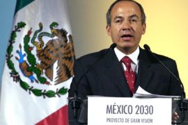 AFP/Mexican President elect Felipe Calderon waves after delivering a speech 10 October, 2006 in Mexico City during which he launched the Mexico 2030 project