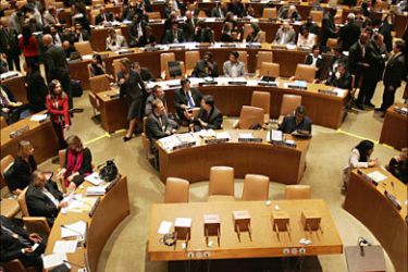 f_Ballot boxes sit on a bare table (front center) during a vote for the non-permanent members of the Security Council 25 October 2006 at the