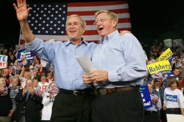 AFP/Republican US Senator Conrad Burns (R) and US President George W. Bush greet the crowd during a campaign rally at Metrapark Arena 02 November 2006 in Billings, Montana. Bush is in Montana to attend the campaign rally ahead of the 07 November midterm Congressional elections. AFP PHOTO/Mandel NGAN