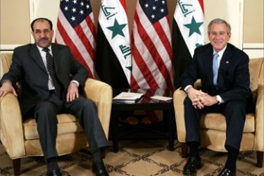 U.S. President George W. Bush (R) meets with Prime Minister of Iraq Nuri al-Maliki in Amman November 30, 2006. Bush met with Maliki to seek ways to stem sectarian carnage threatening to split Iraq.